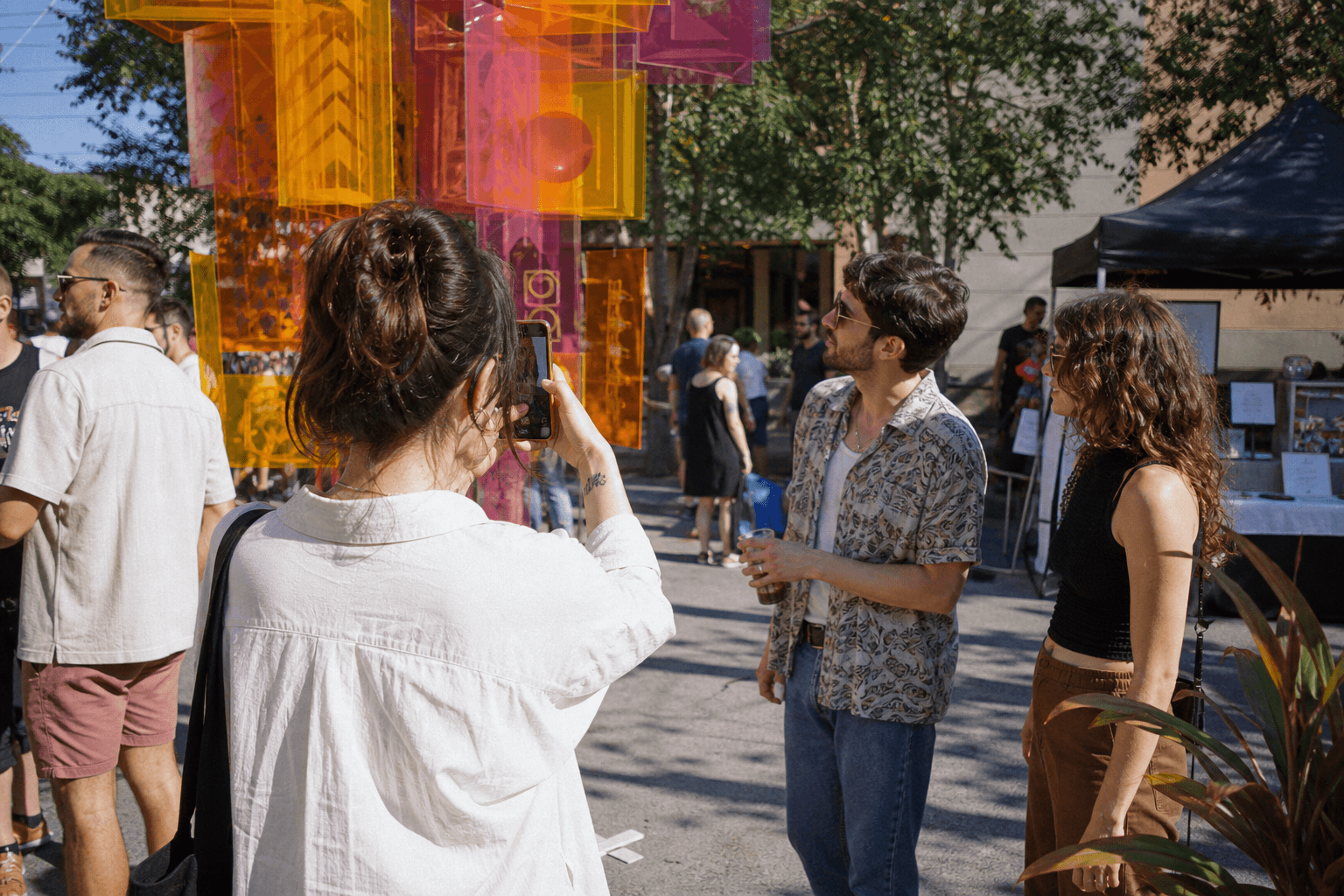 People exploring a community arts event